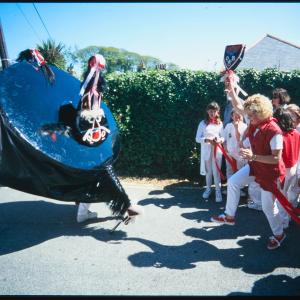 Woman teasing Old Oss in sun