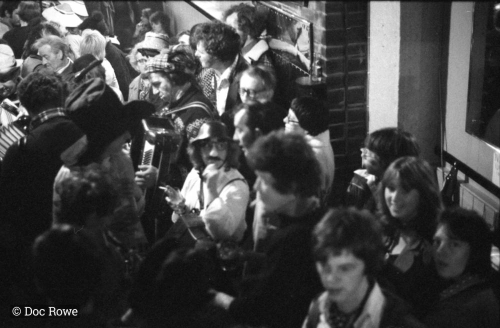 merrymakers in packed pub