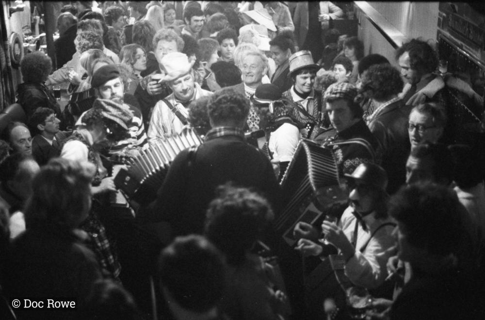merrymakers in packed pub