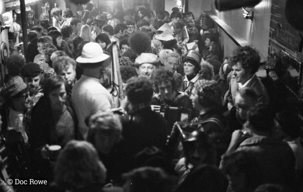 merrymakers in packed pub