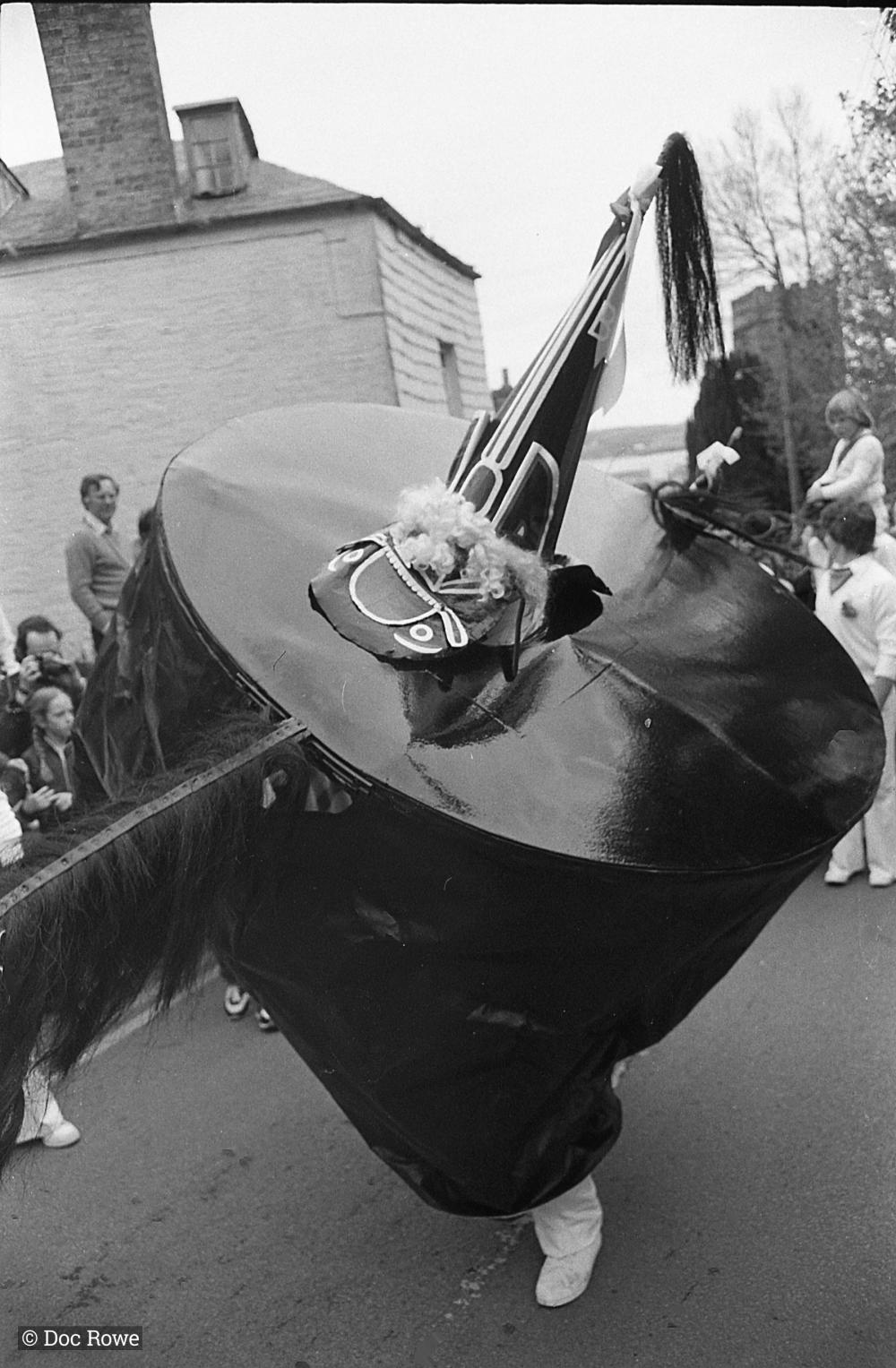 Old Oss dancing, church in background