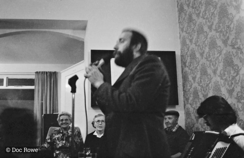 man singing into microphone