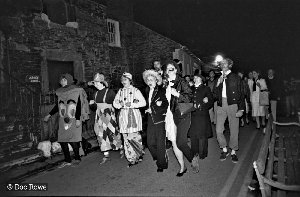 Merrymakers on street at night outside Abbey House