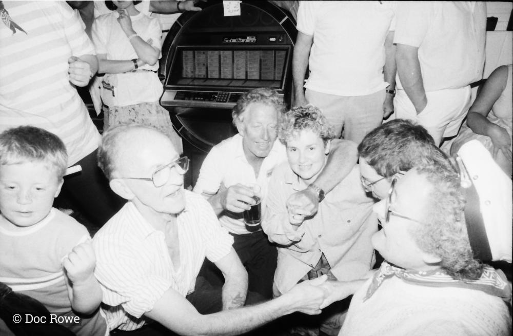 people crouched down in pub