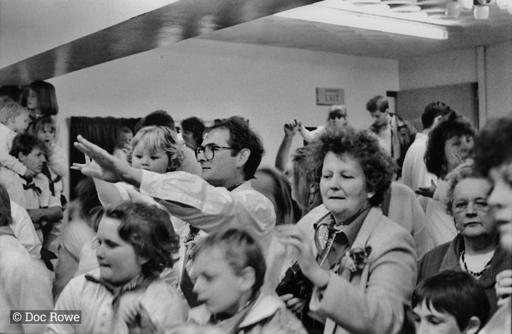 people watching teaser indoors