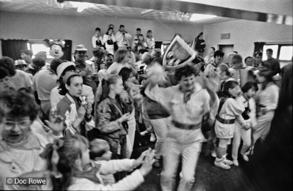 teaser dancing surrounded by children