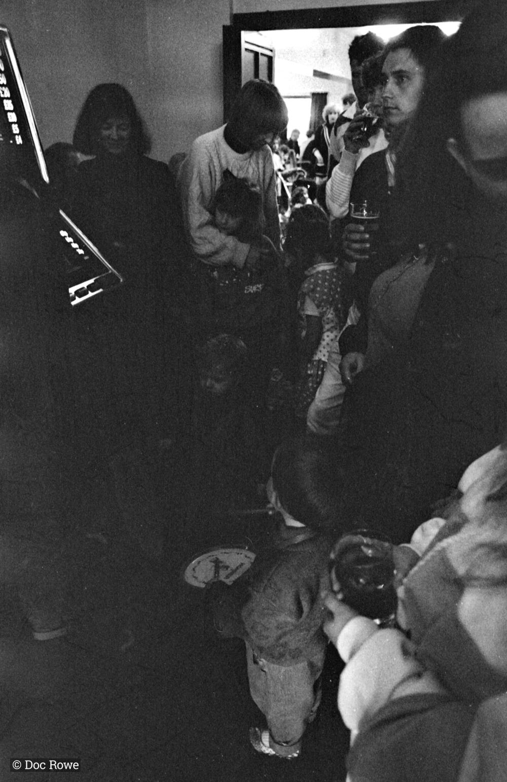 people in doorway of pub