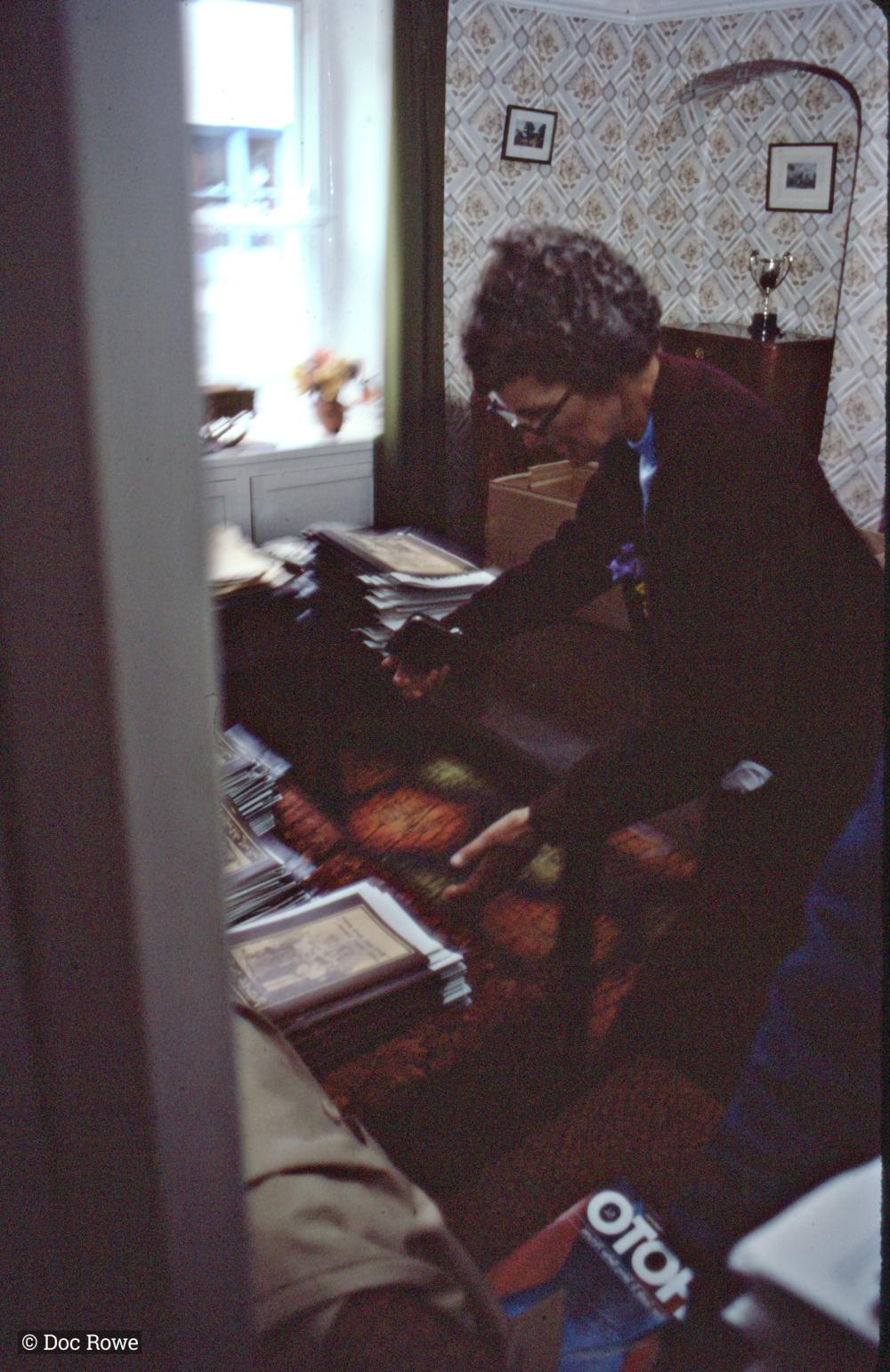 Someone with stacks of documents