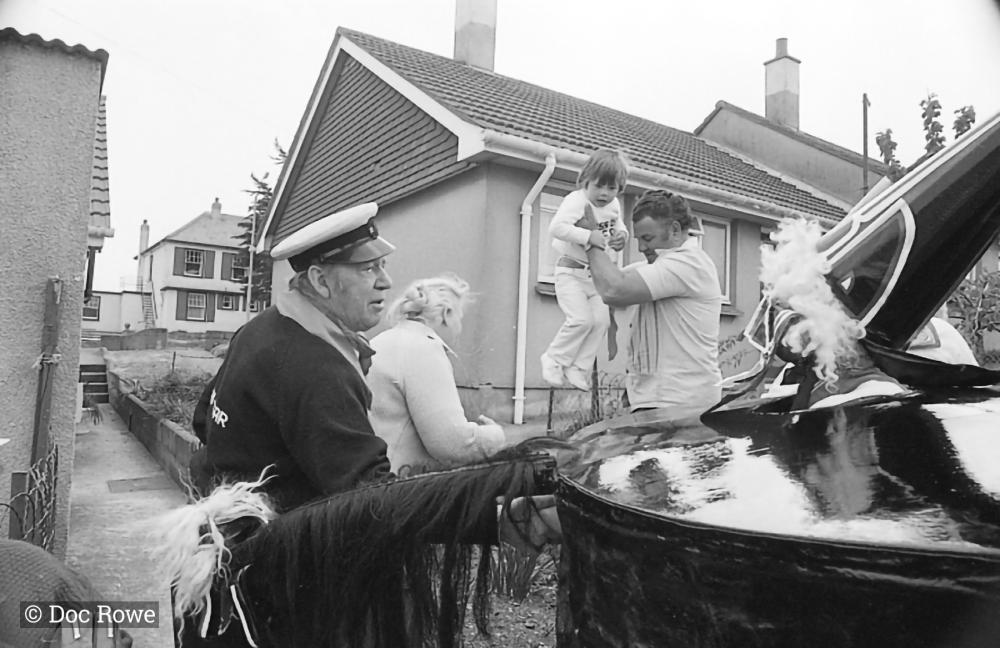 man holding toddler with old oss