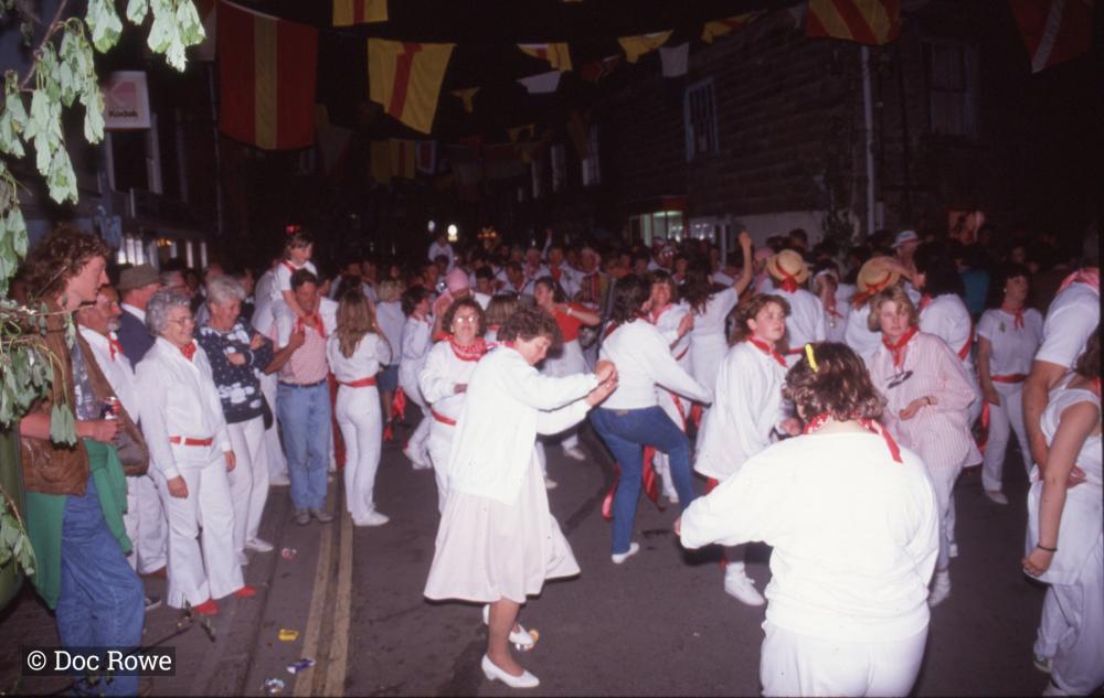 Old Oss party dancing on street at night