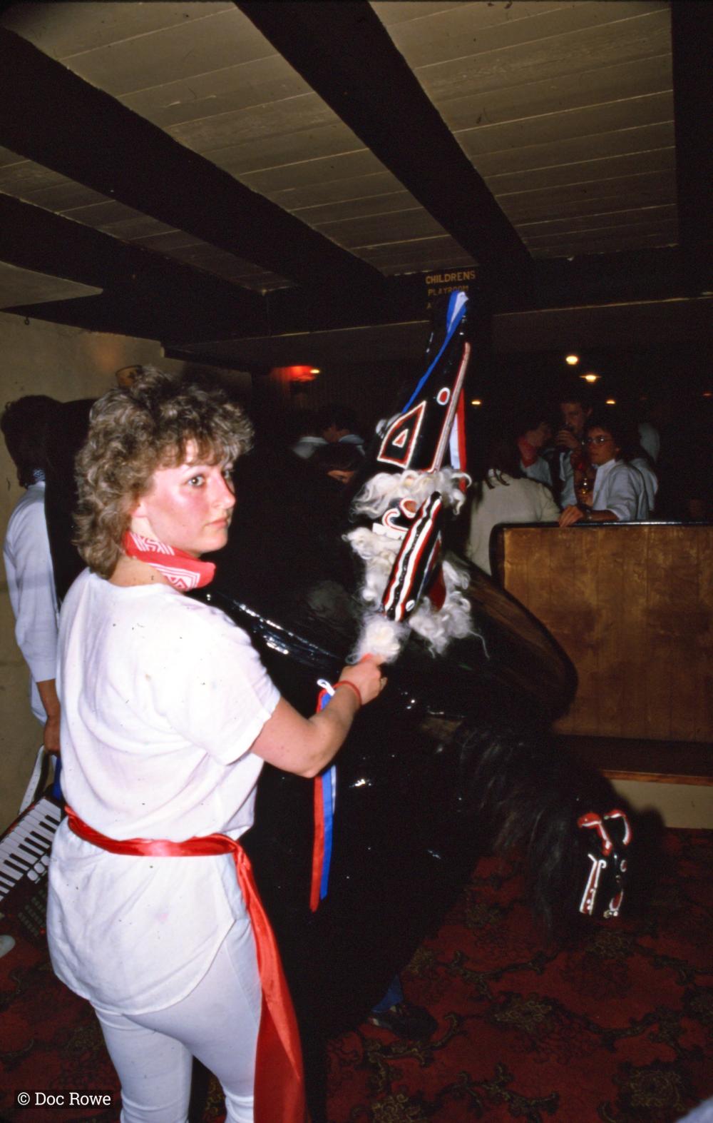Woman from Old Oss teasing Blue Ribbon Oss