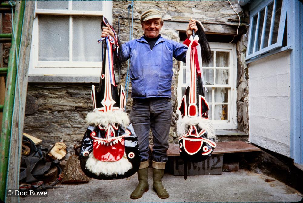 Doc Rowe holding Old Oss and Blue Ribbon Oss hats