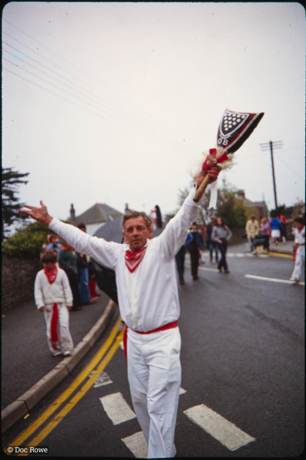 Old Oss teaser holding club in air