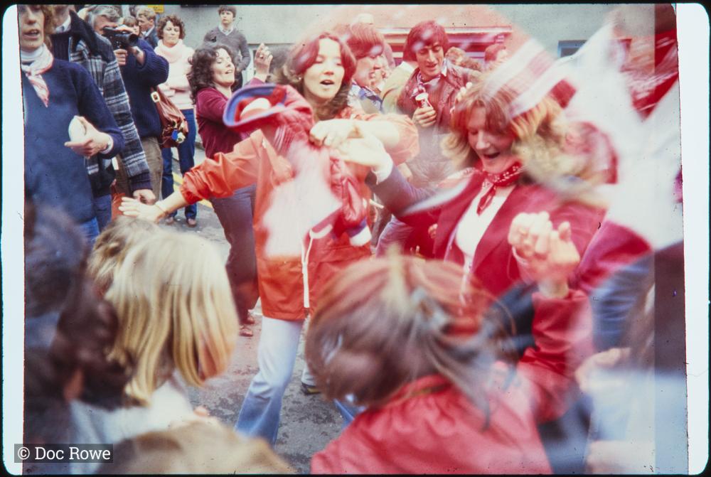 Women and children dancing