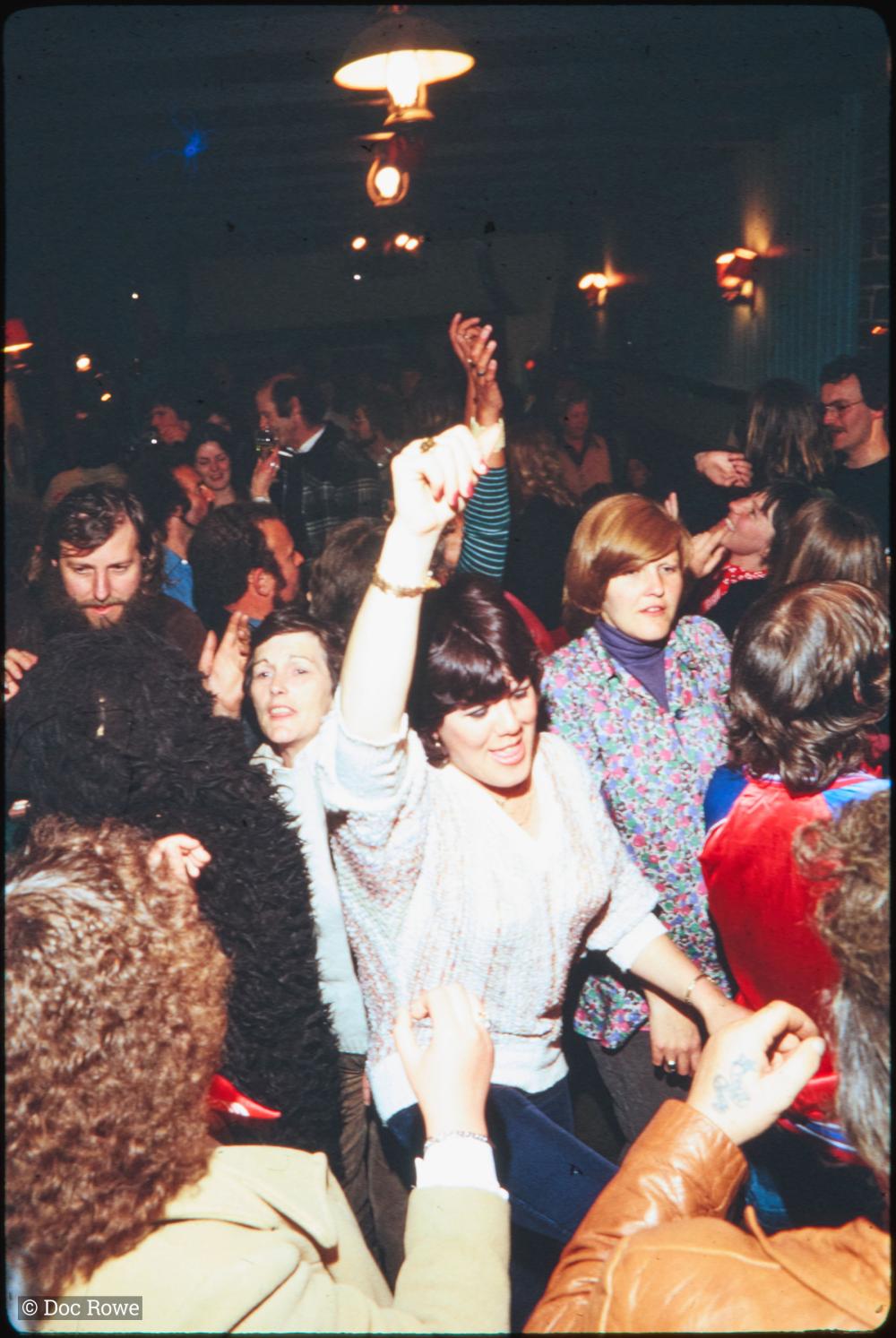 Woman dancing in crowded bar