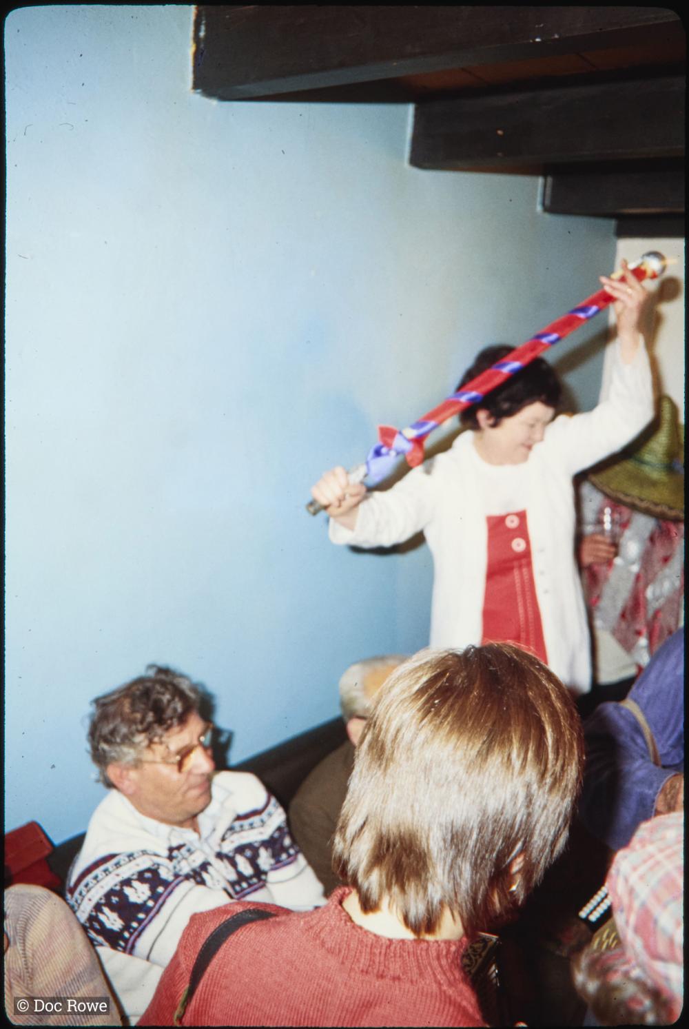Woman with pole in pub