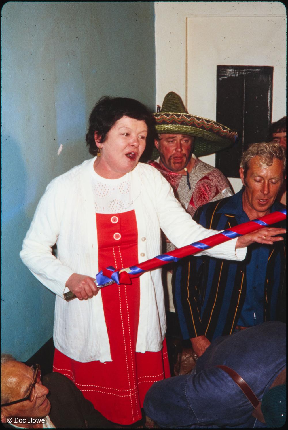 Woman with pole in pub