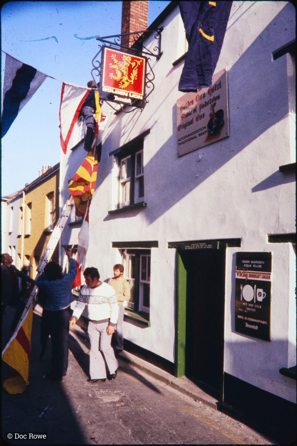 Putting up flags outside Golden Lion