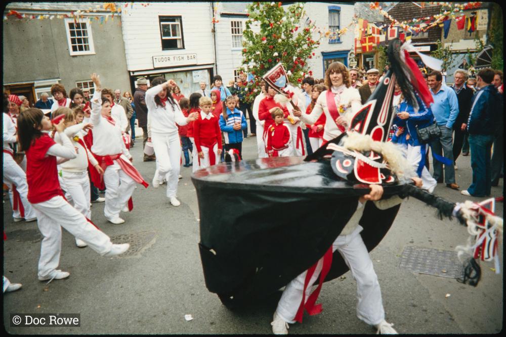 Children Oss being teased under Maypole