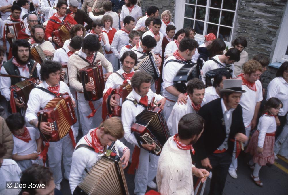 Old Oss procession walking along road