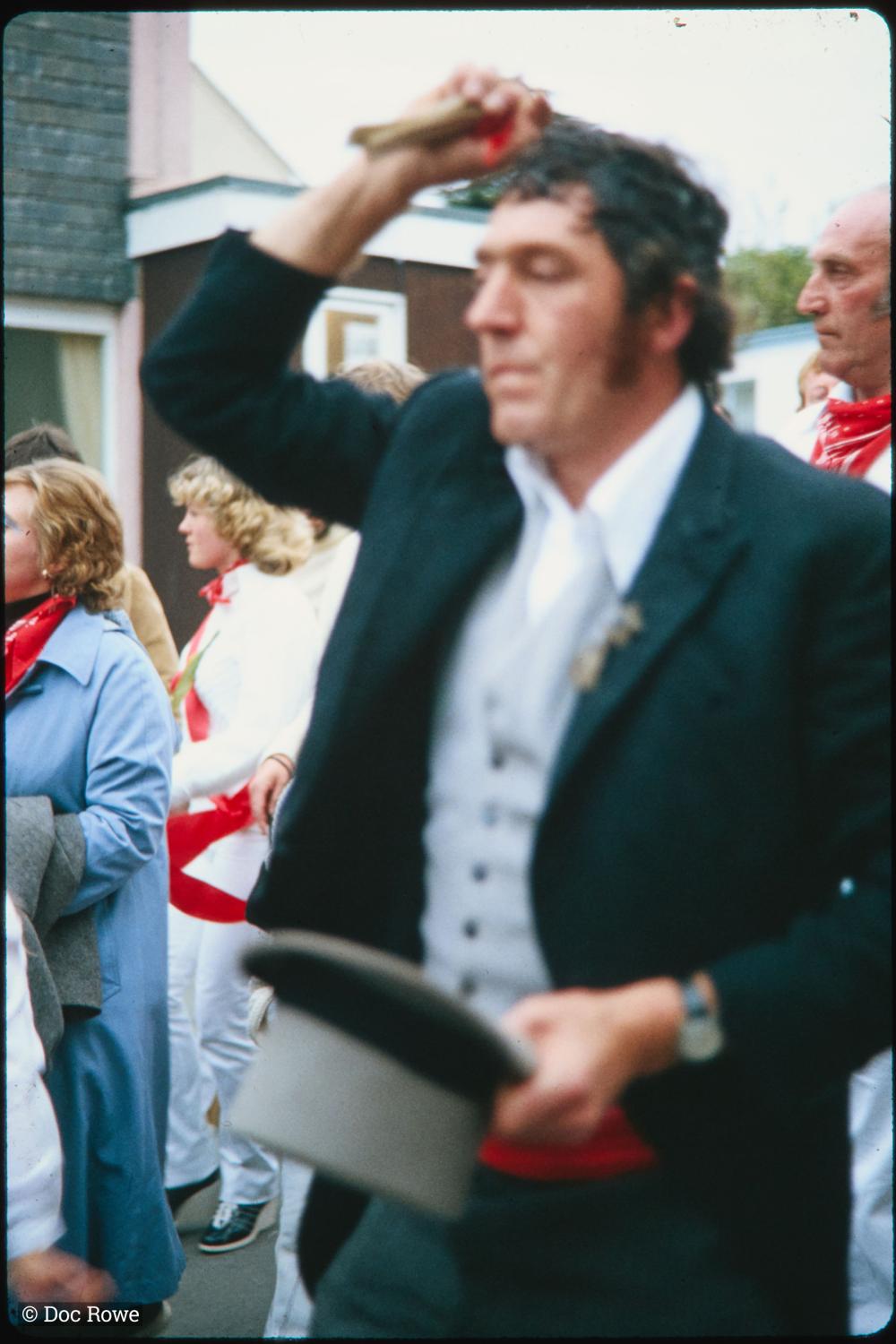 Master of Ceremonies taking off his hat 