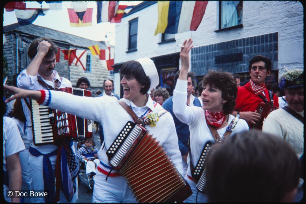 Women playing accordions in procession
