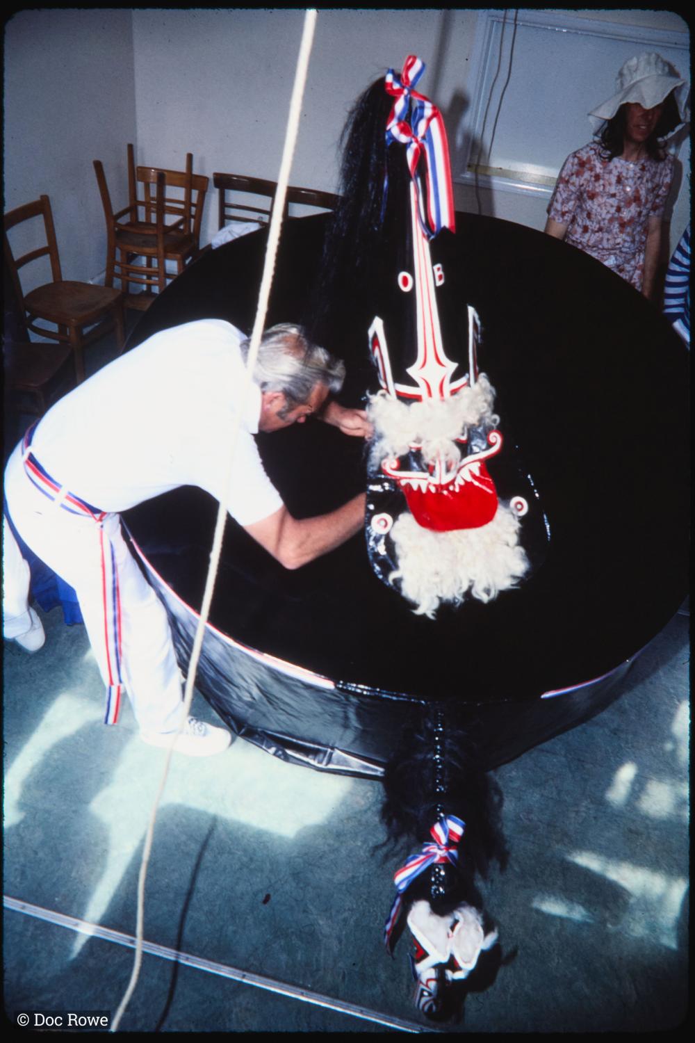 Blue Ribbon hat being placed on rider's head