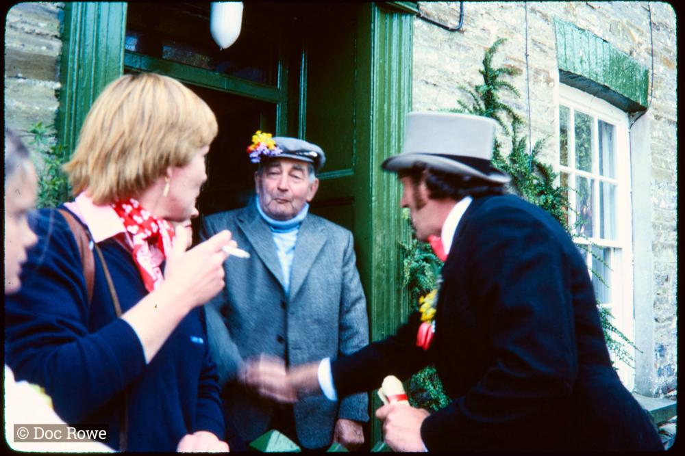 Master of Ceremonies greeting man in doorway