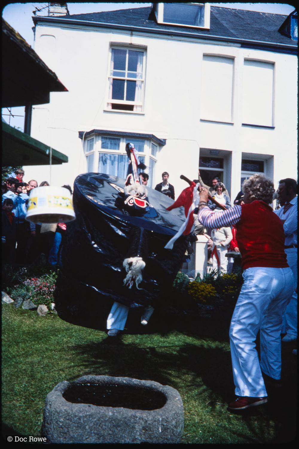 Old Oss being teased in garden of house