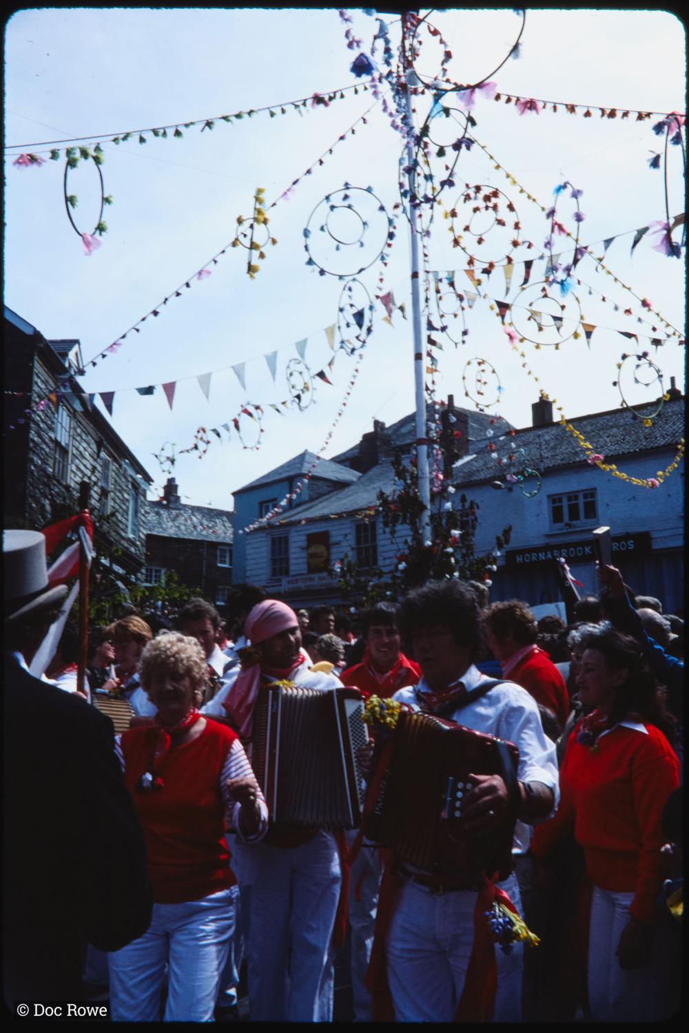 accordion players under maypole
