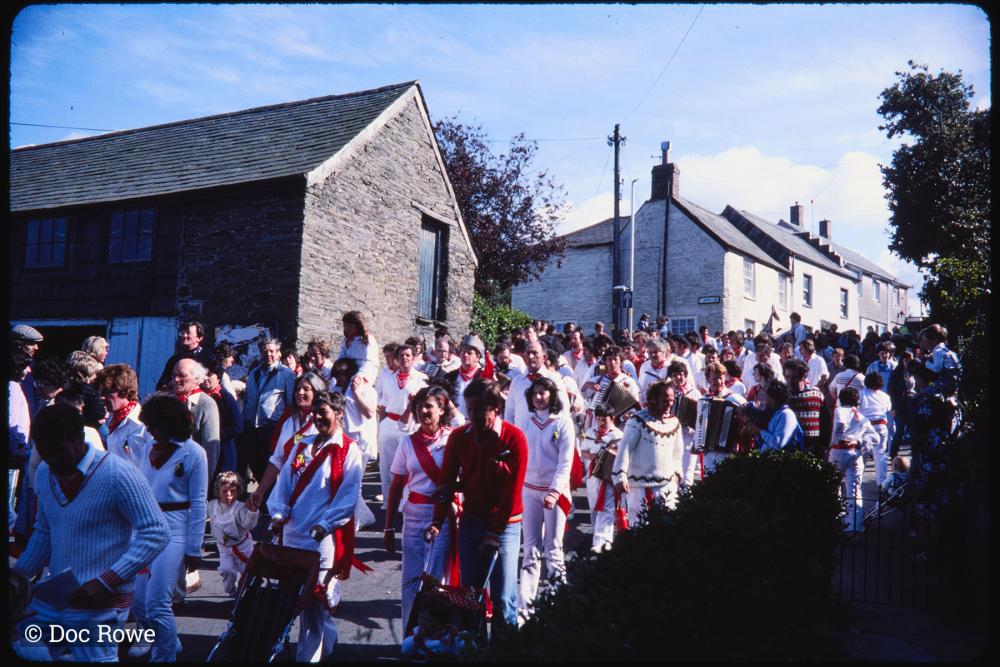 Old Oss procession walking down road
