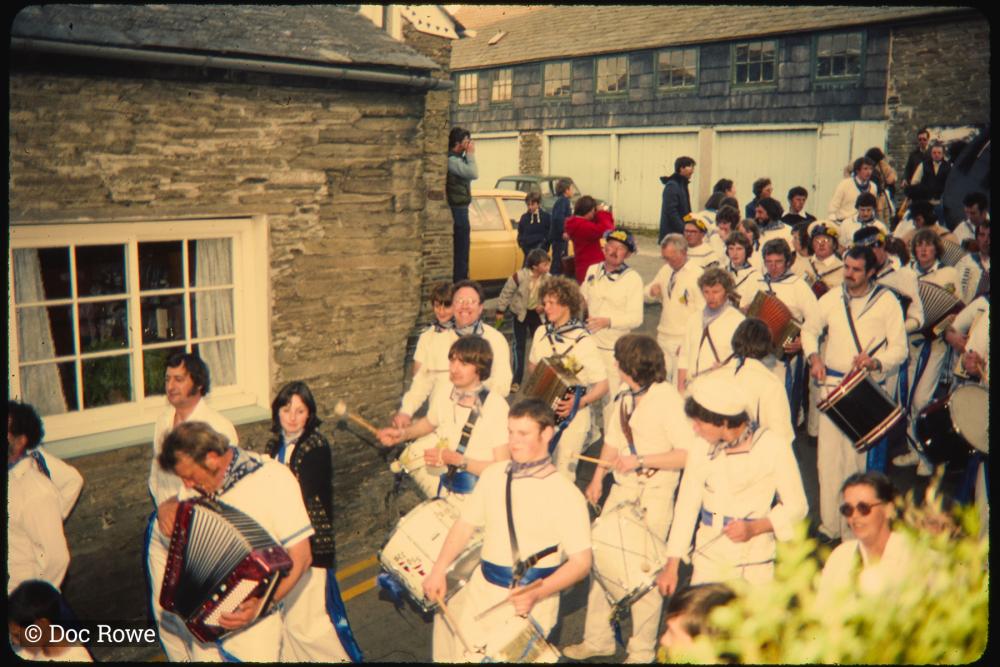 Blue Ribbon band walking along road in procession