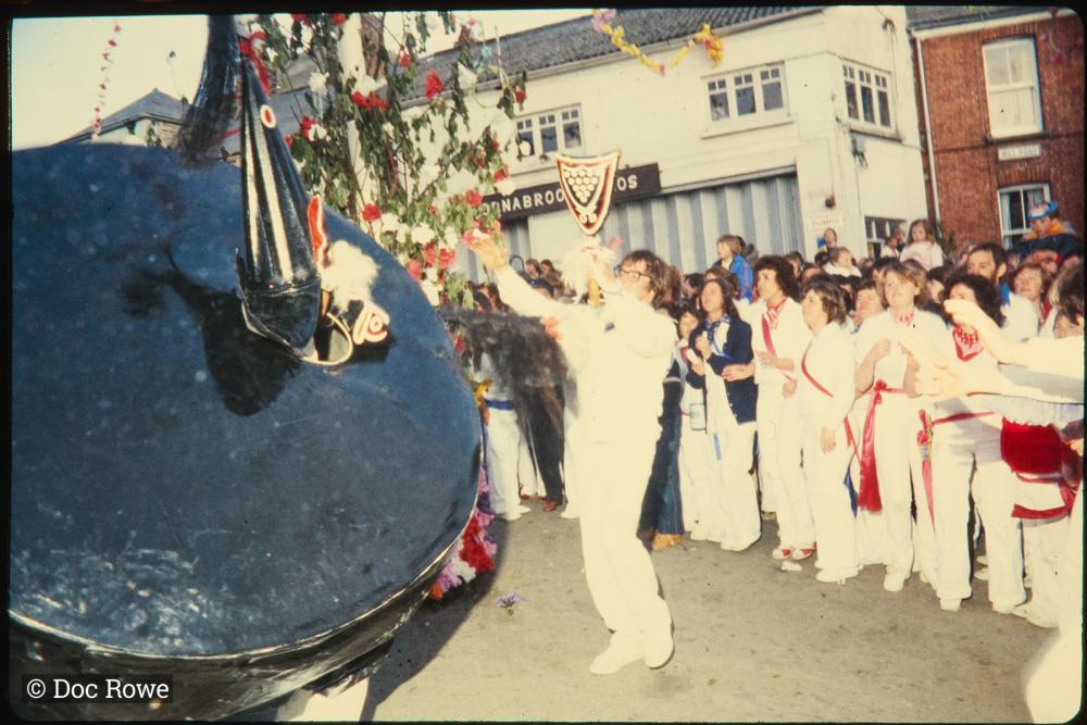 Old Oss being teased under maypole