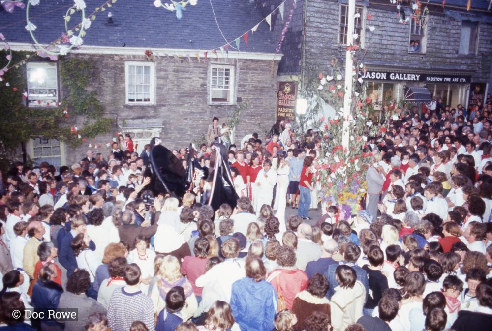 Crowds gathered under the maypole with the osses 