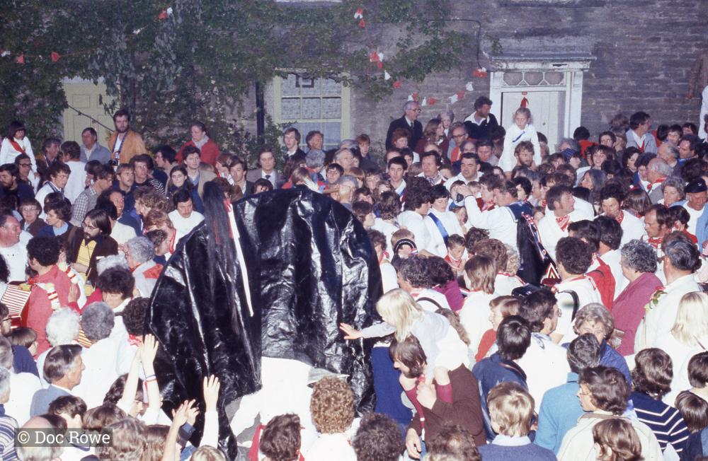 Crowds gathered under the maypole with the osses