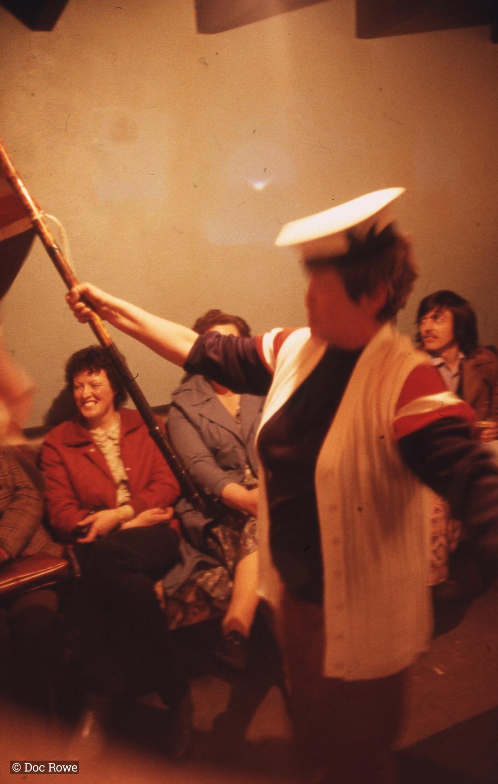 Woman singing, holding union flag