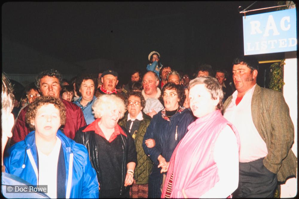 People singing at night