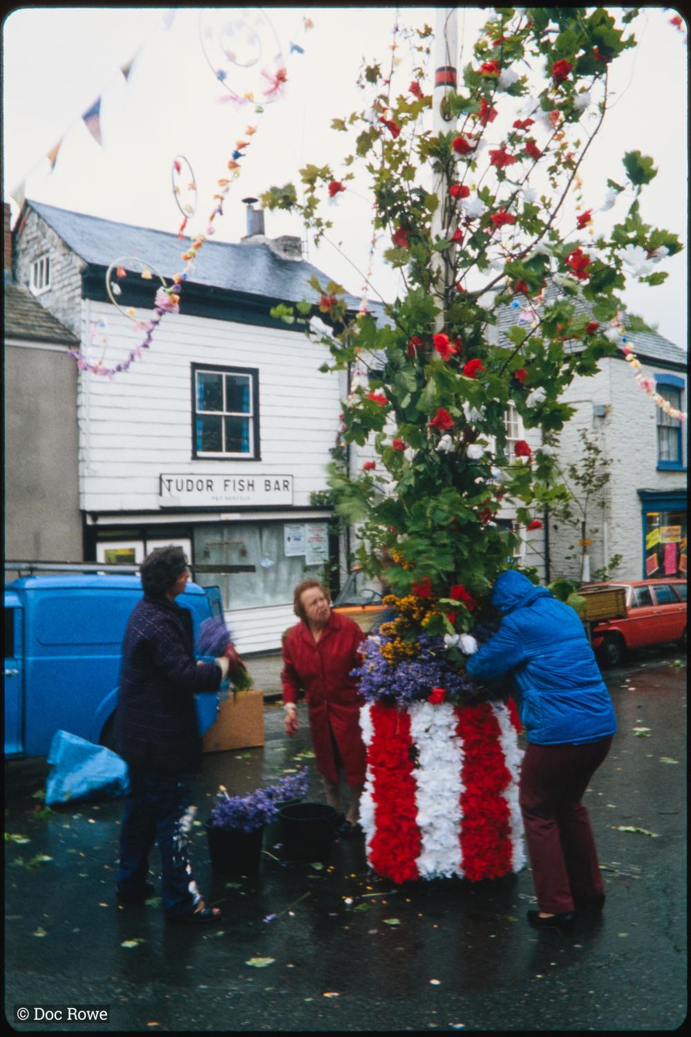 Maypole being prepared in the rain