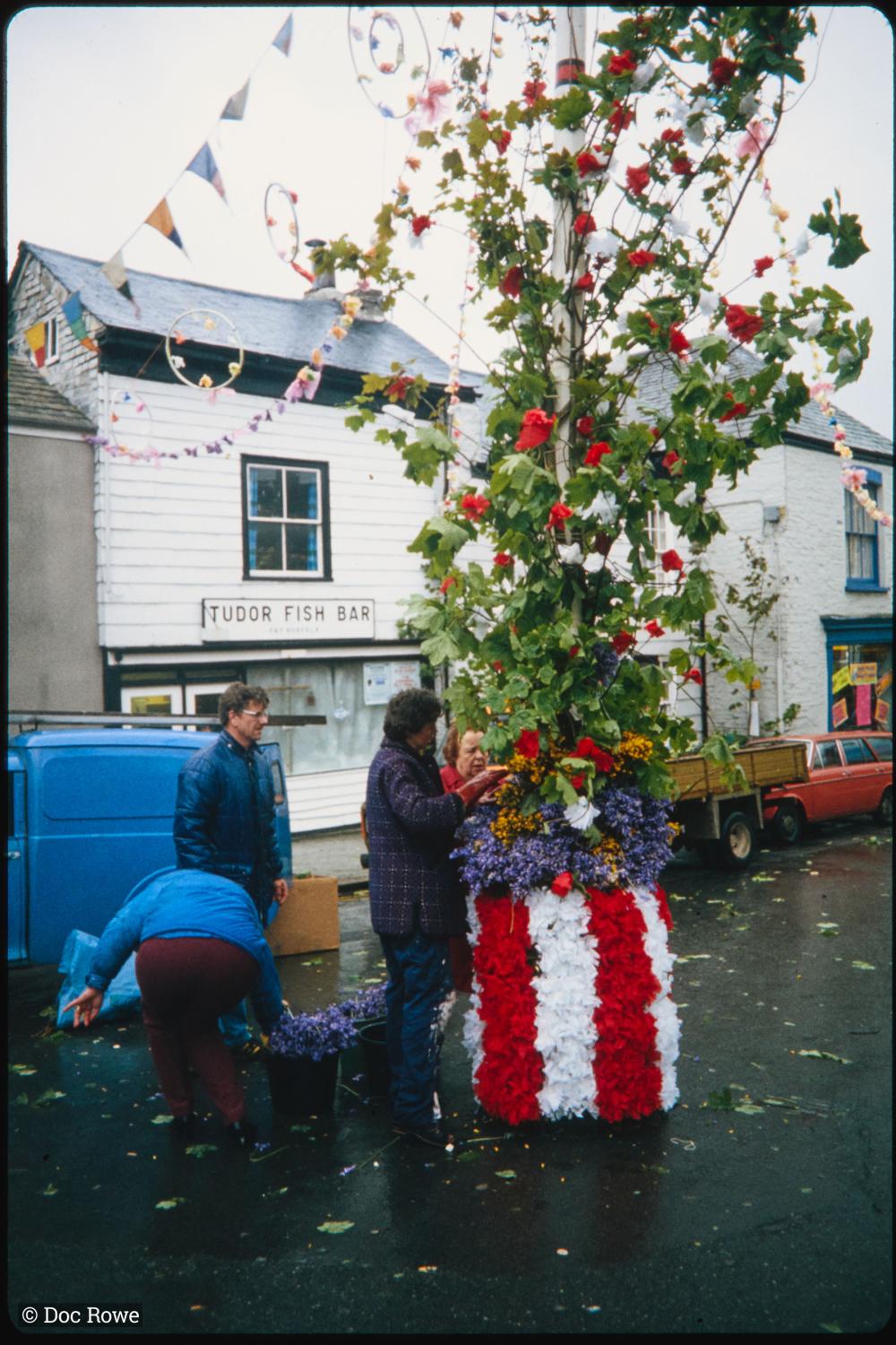 Maypole being prepared in the rain