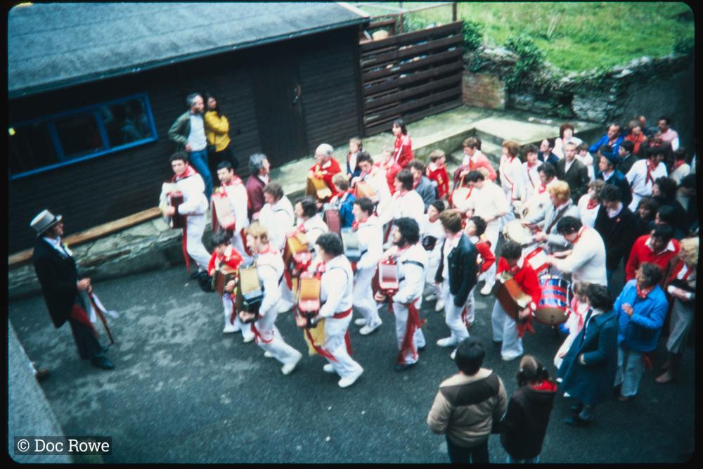 Old Oss band with master of ceremonies in alleyway 