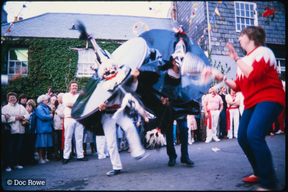 Blue Ribbon and Old Oss colliding under maypole
