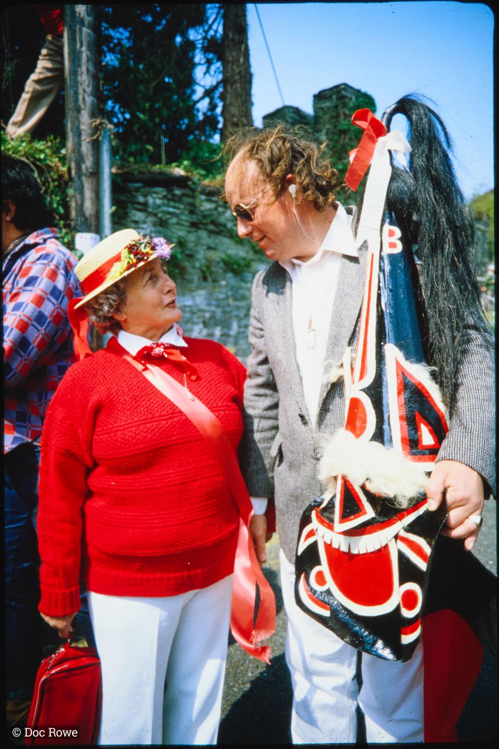 Man holding Old Oss hat with woman