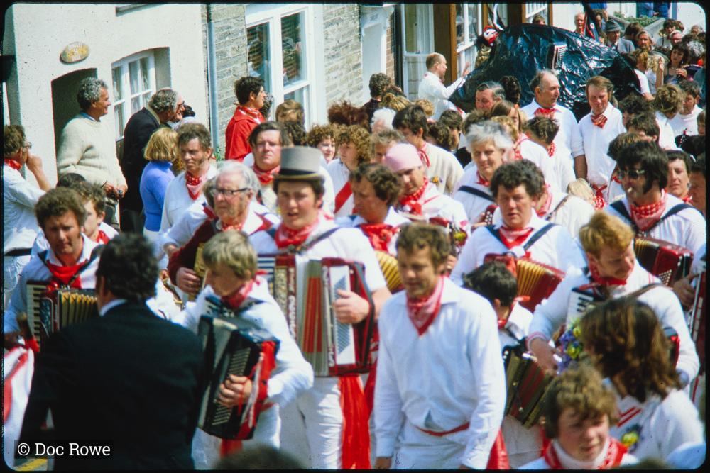 Old Oss accordion players walking in procession