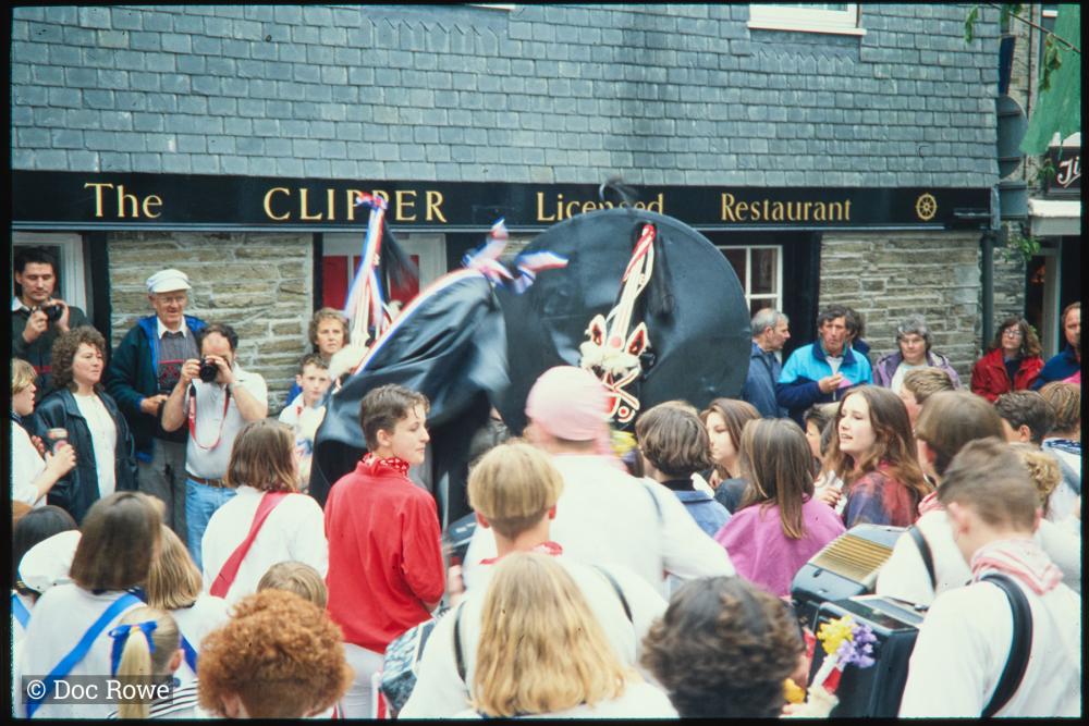 Blue Ribbon Oss and Old Oss dancing together at Mill Square