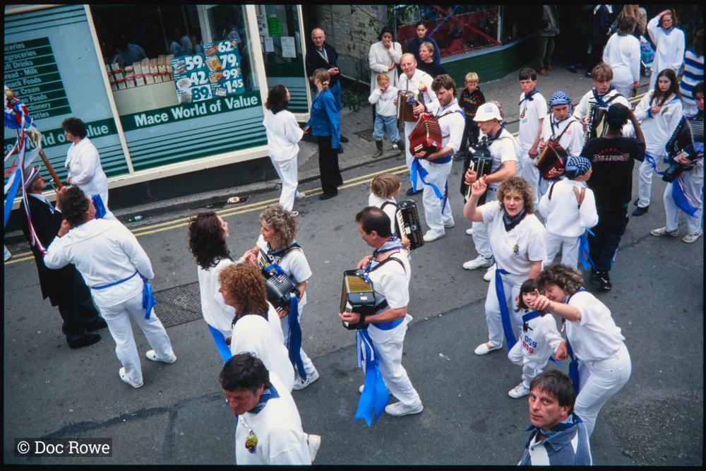 Blue Ribbon accordion players and dancers in town