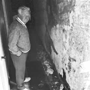 man in alleyway