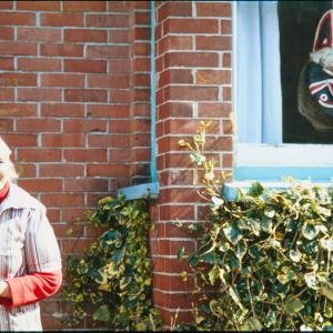 Woman smiling from doorway