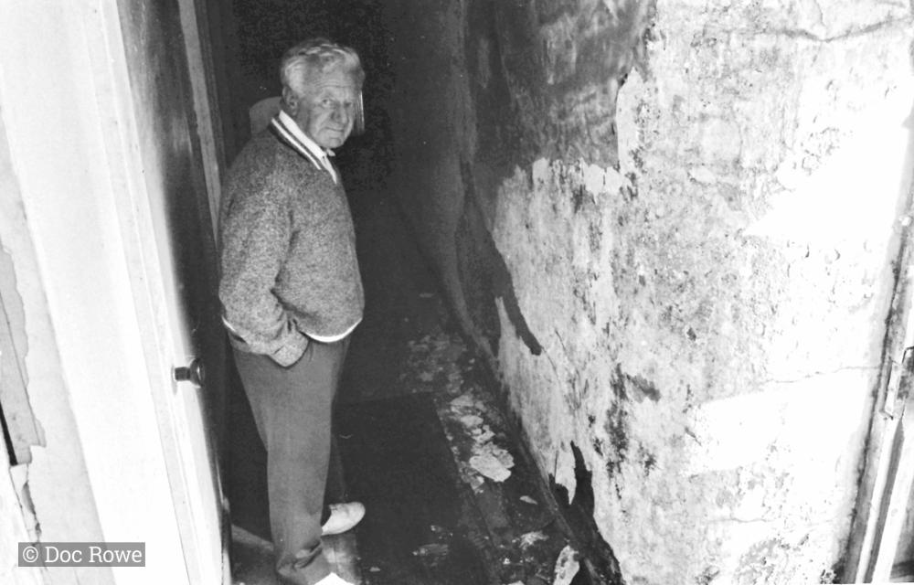 man in alleyway
