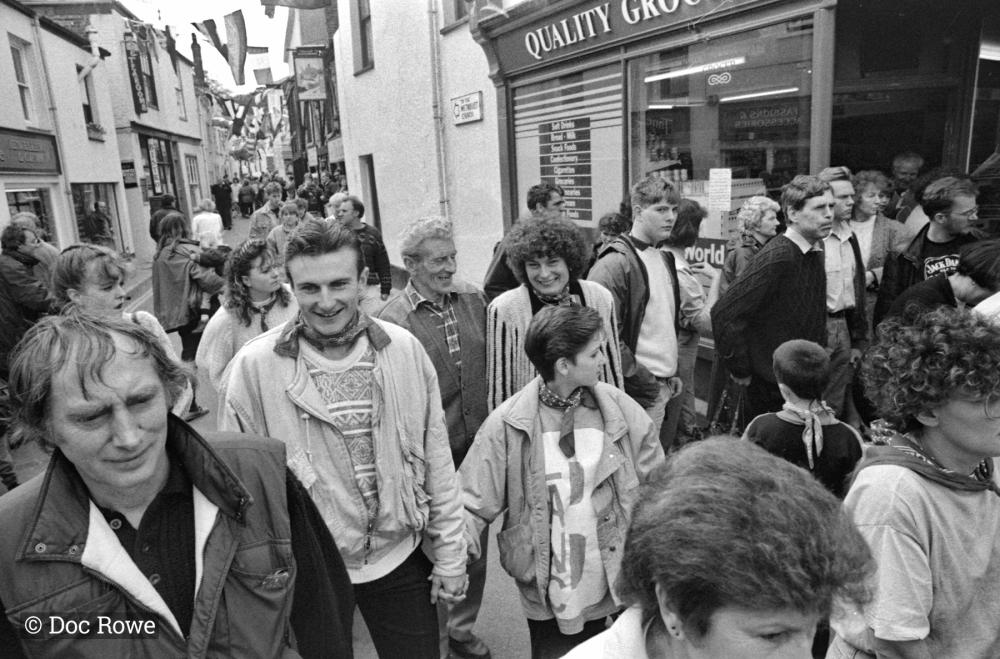 People in procession in street