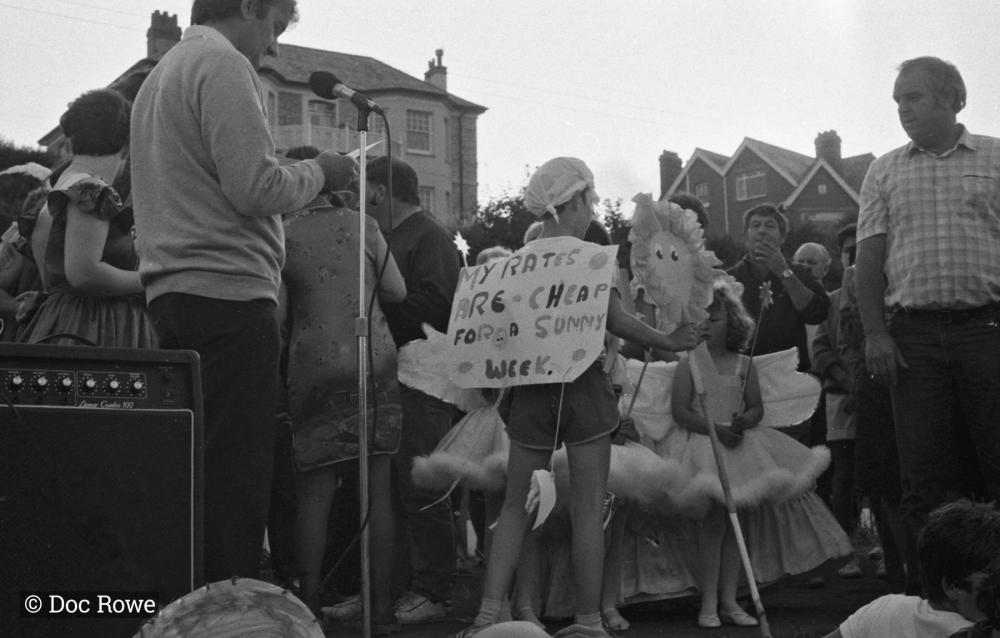 children dressed up beside microphone and amp